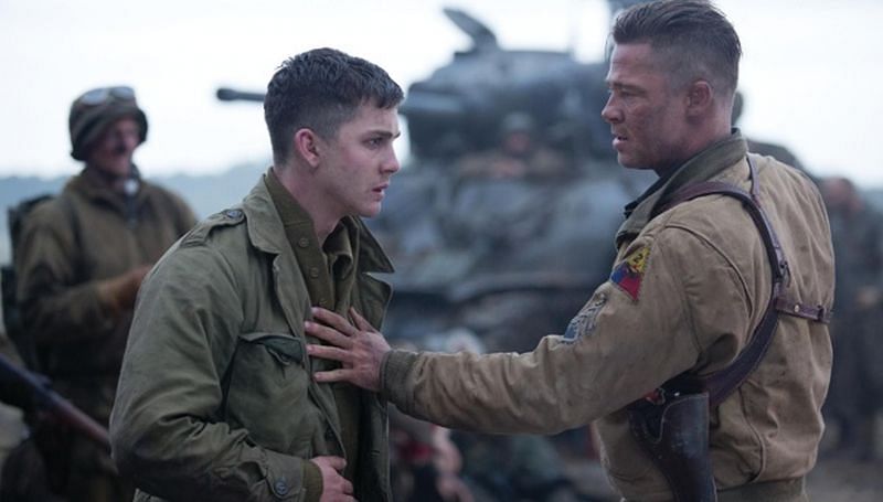 Logan Lerman in Fury (2014) along with co-star Brad Pitt (Image via Columbia Pictures)