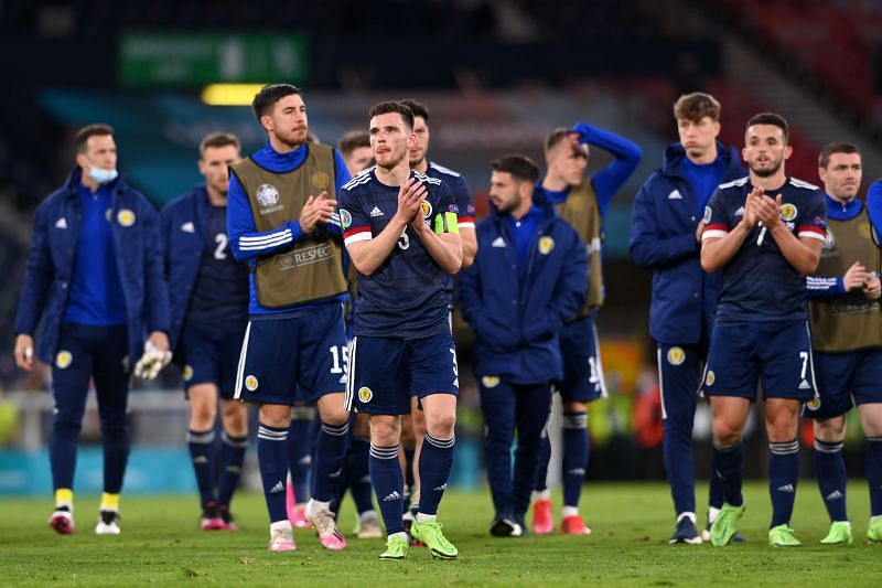 A dejected Scotland team acknowledge the crowd after their defeat to Croatia