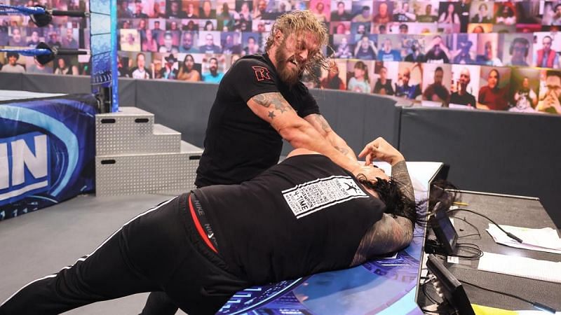 Edge returned to take out and challenge Roman Reigns.