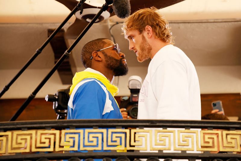 Floyd Mayweather (left) faces off against Logan Paul (right)