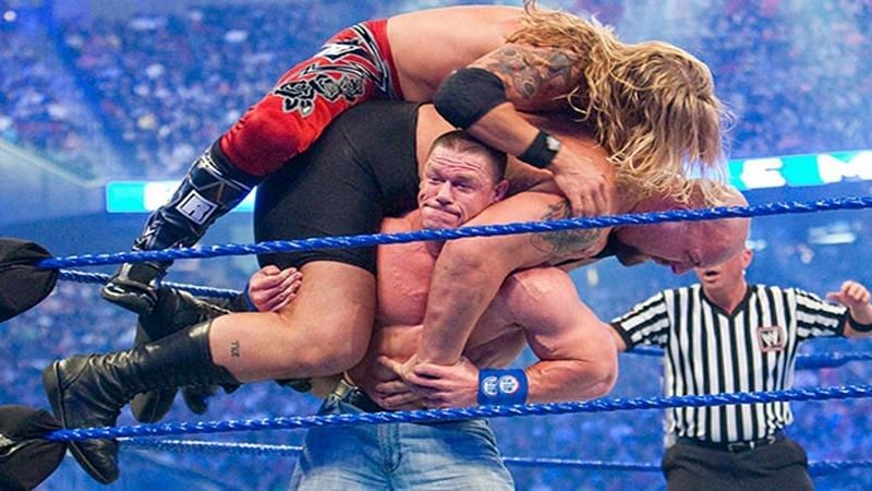 John Cena, with Edge and Big Show on his shoulders