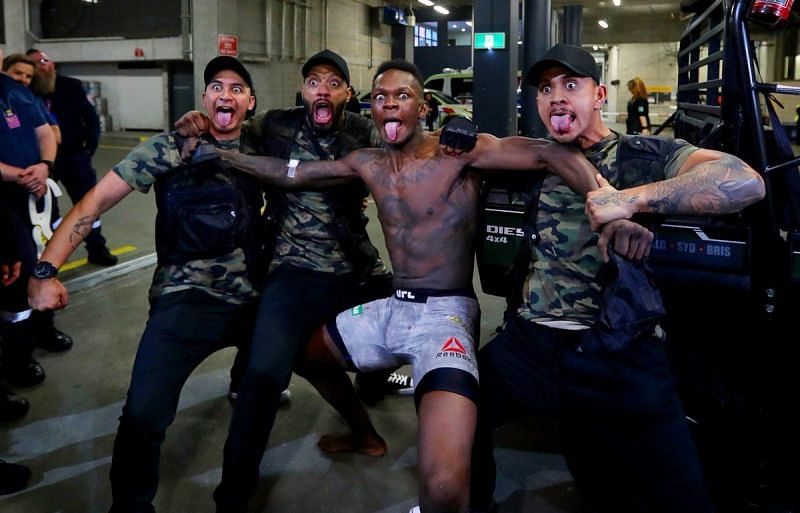 Israel Adesanya dances at a UFC event