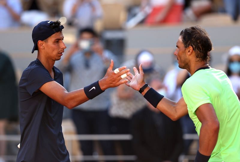 Rafael Nadal shakes hands with Alexei Popyrin after their first round match