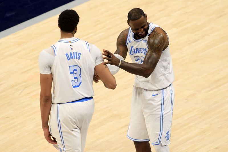 LeBron James #23 talks with Anthony Davis #3 during an LA Lakers&#039; game.