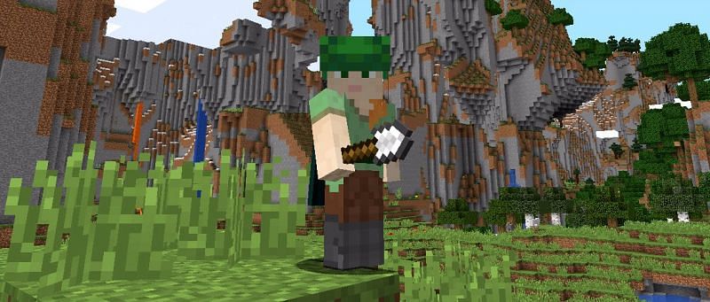 Alex with a fancy hat and an iron shovel (Image via Mojang)