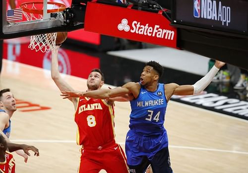 Danilo Gallinari #8 goes up for a basket against Giannis Antetokounmpo #34.