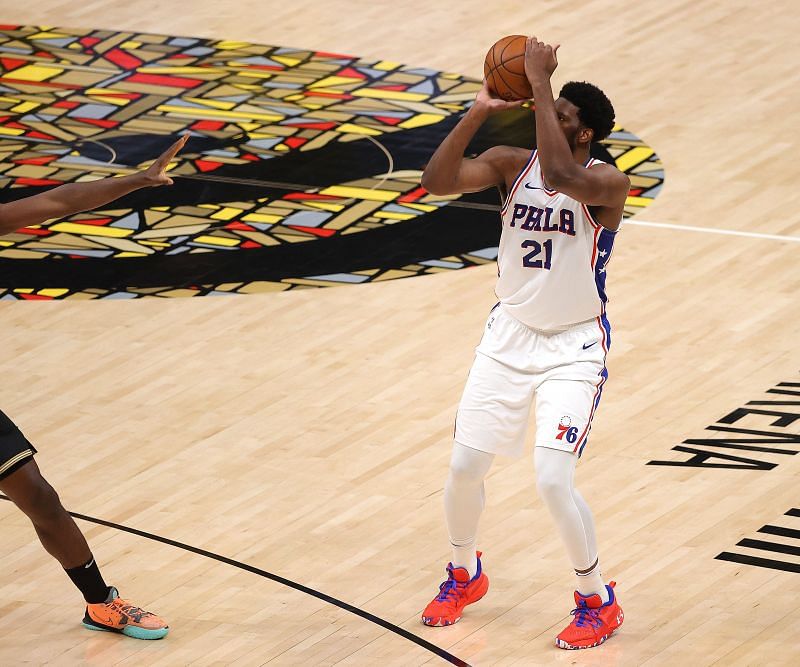 Joel Embiid #21 prepares to shoot a three-point basket