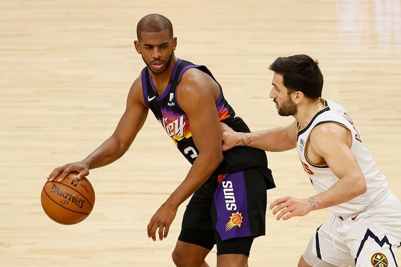 Chris Paul is guarded by Facundo Campazzo