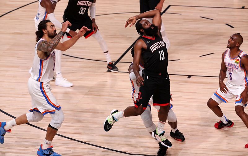 James Harden (#13) of the Houston Rockets inbounds the ball during the fourth quarter against the Oklahoma City Thunder in Game Seven of the Western Conference First Round in the 2020 NBA Playoffs.