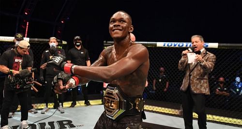 Israel Adesanya celebrating his win over Paulo Costa at UFC 253