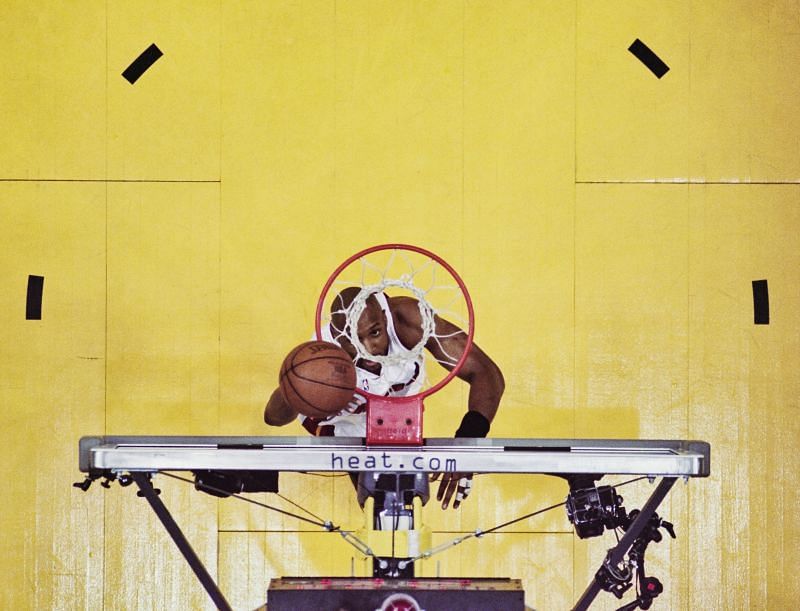 Center and Power Forward for the Miami Heat looks up through the basketball hoop.