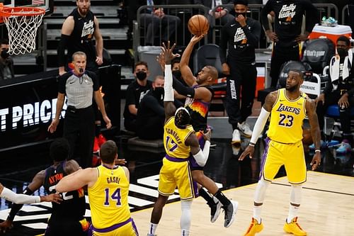 Chris Paul #1 puts up a shot over Dennis Schroder #17.