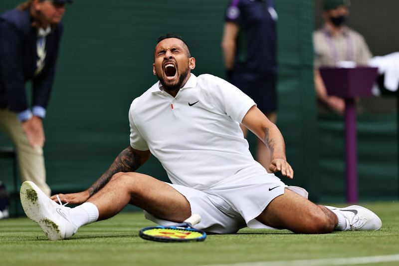 Nick Kyrgios lets out a scream after falling