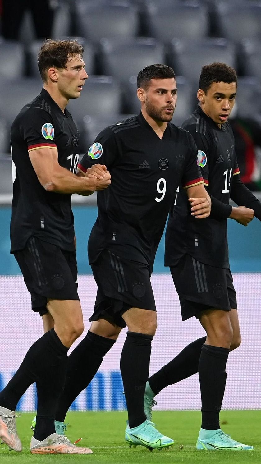 Germany's Mats Hummels, centre, heads on goal during the Euro 2020