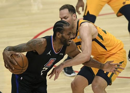 Kawhi Leonard drives against Bojan Bogdanovic