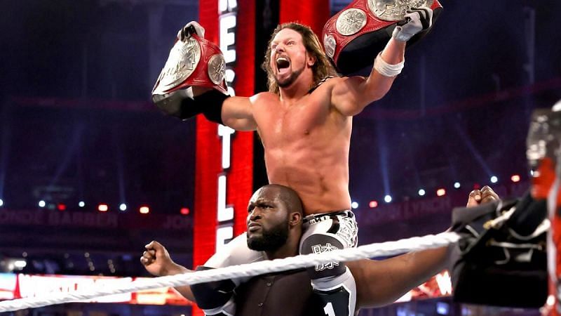 AJ Styles and Omos celebrating their WWE RAW Tag Team Championship win at WrestleMania 37