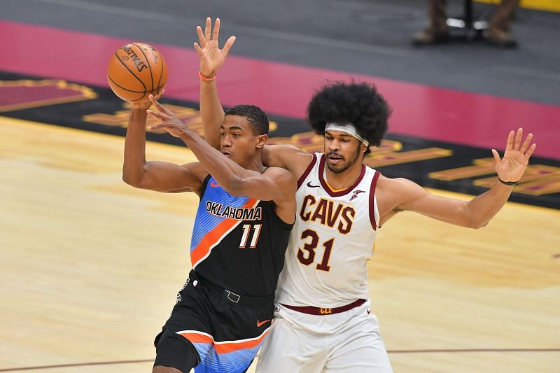 Theo Maledon #11 passes while being guarded by Jarrett Allen #31.
