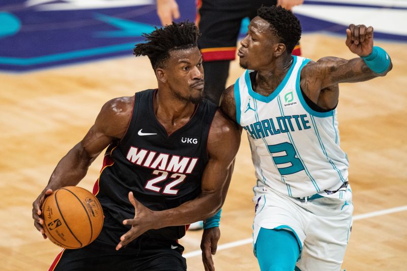 Jimmy Butler #22 drives to the basket while guarded by Terry Rozier #3.