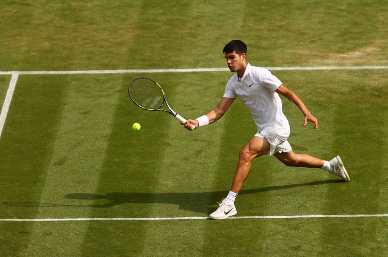 Carlos Alcaraz in action against Daniil Medvedev