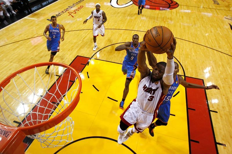 Dwayne Wade #3 leaps for a dunk