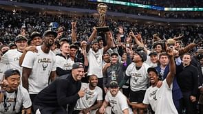 Triple H congratulates Giannis Antetokounmpo and the Milwaukee Bucks with a customized championship belt