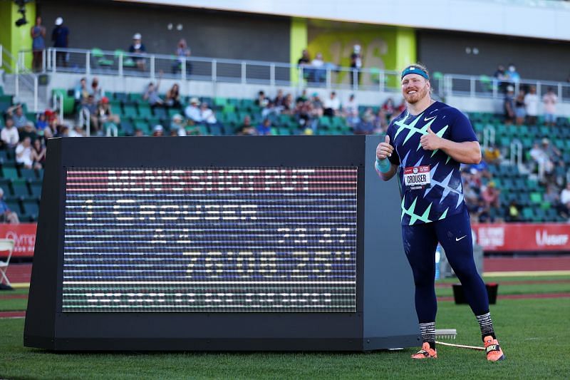 Ryan Crouser alongside the display board flashing his WR in shot put at US Olympic Track and Field Trials 2021