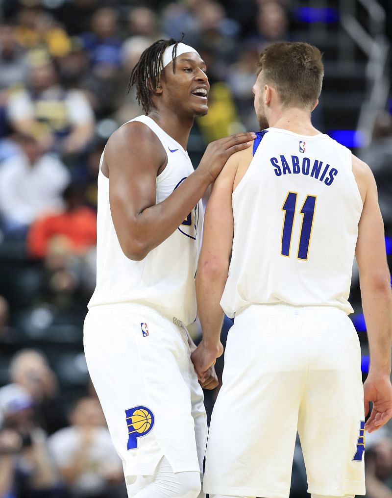 Myles Turner #33 of the Indiana Pacers celebrates with Domantas Sabonis #11