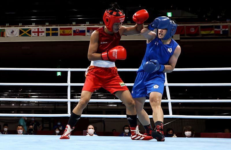 Lovlina (L) in action against Chen Nien-Chin of Taipei in the quarterfinal boxing match at the 2021 Tokyo Olympics
