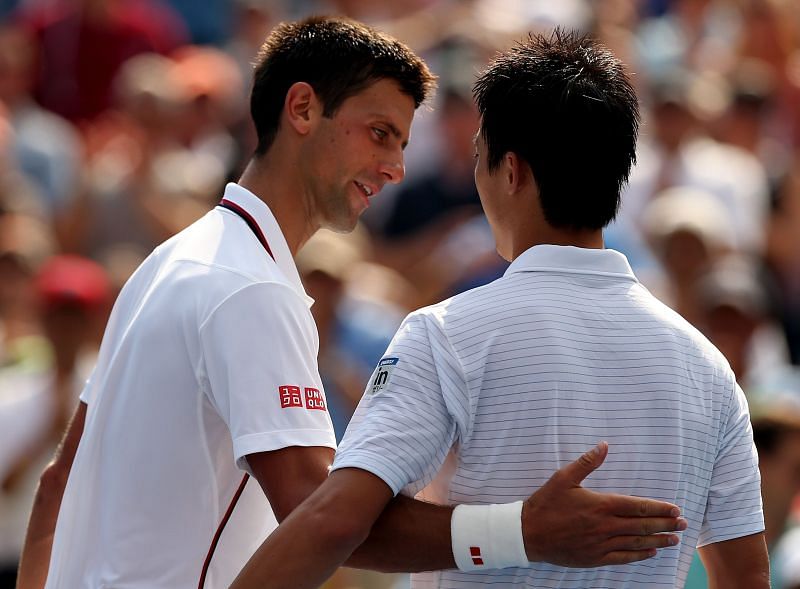 Novak Djokovic greets Kei Nishikori after their match at the 2014 US Open