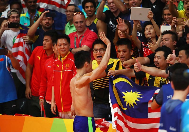 Lee Chong Wei celebrates with Malaysian fans after beating Lin Dan at the Rio Olympics