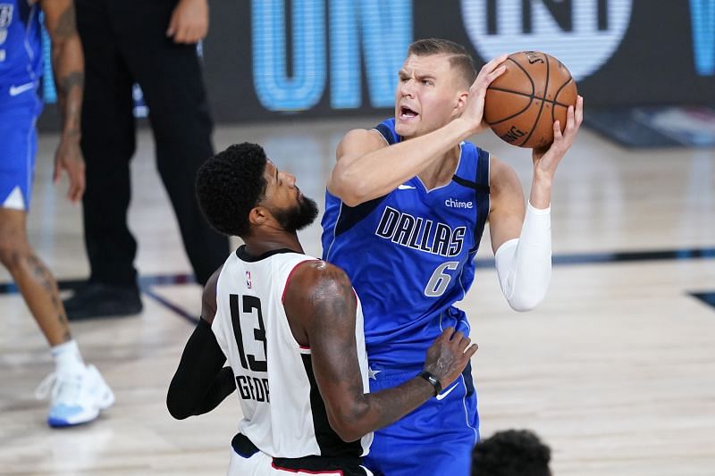Kristaps Porzingis #6 is defended by Paul George #13.