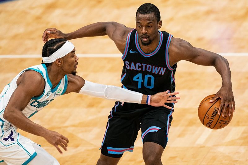 Harrison Barnes #40 of the Sacramento Kings brings the ball up court while guarded by Devonte&#039; Graham #4 of the Charlotte Hornets