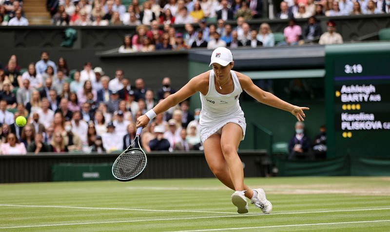 Ashleigh Barty hitting a backhand slice during Wimbledon 2021