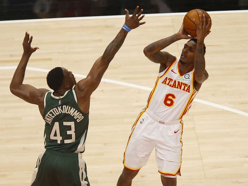 Guard Lou Williams #6 of the Atlanta Hawks shoots over forward Thanasis Antetokounmpo.