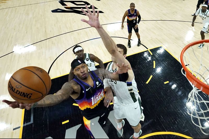 Torrey Craig shoots as &lt;a href=&#039;https://www.sportskeeda.com/basketball/brook-lopez&#039; target=&#039;_blank&#039; rel=&#039;noopener noreferrer&#039;&gt;Brook Lopez&lt;/a&gt;, right, defends during the first half of Game 5.