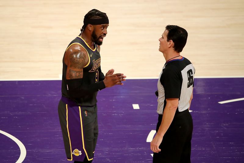 Wesley Matthews #9 talks with referee Mark Ayotte #56