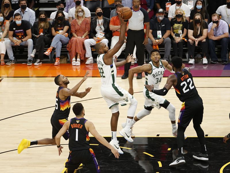 Khris Middleton tries to finish in traffic