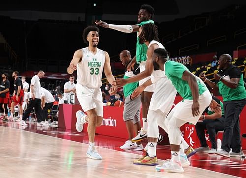 Jordan Nwora #33 of Team Nigeria celebrates a basket with teammates against Germany.