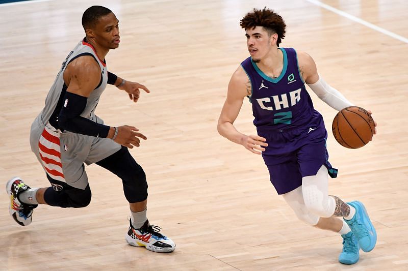 LaMelo Ball (right) in action for the Charlotte Hornets
