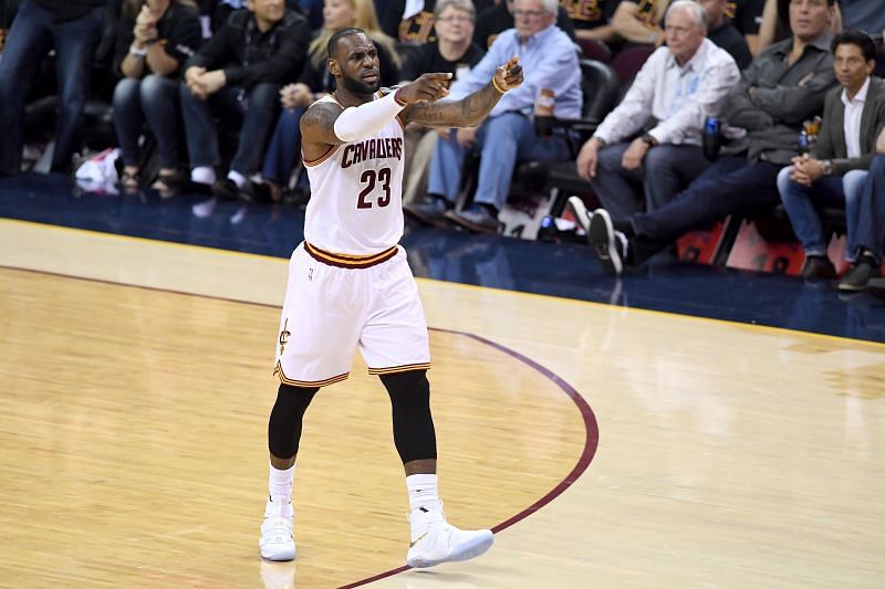 LeBron James #23 reacts while taking on the Warriors.
