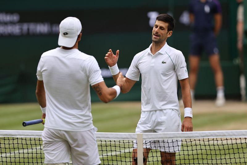 Matteo Berrettini (L) and Novak Djokovic at the end of the Wimbledon 2021 final