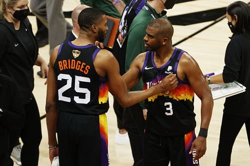 Chris Paul #3 and Mikal Bridges #25 celebrate their Game 2 victory.