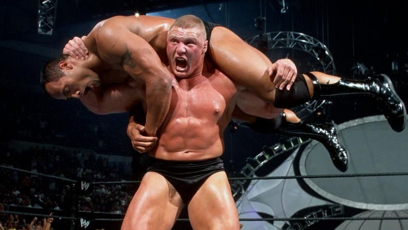 Brock Lesnar setting up The Rock for his F-5 finisher