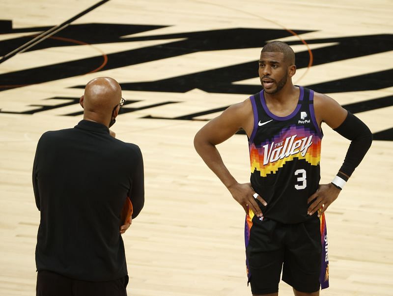 Chris Paul #3 of the Phoenix Suns talks with head coach Monty Williams.