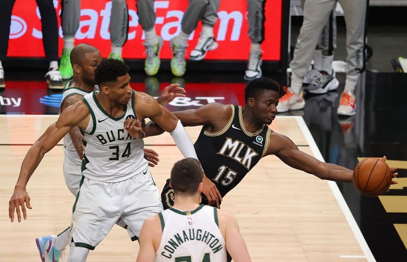 Clint Capela (#15) of the Atlanta Hawks makes a save against Giannis Antetokounmpo (#34) of the Milwaukee Bucks during the first half in Game Four of the 2021 NBA Eastern Conference Finals.