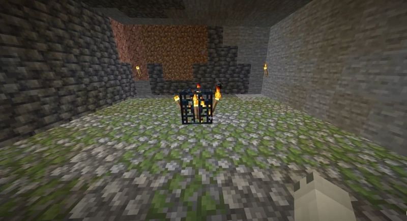 The first step is to enclose the spawner inside a 9x9 clear area
