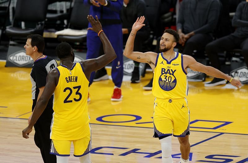 Stephen Curry celebrates with Draymond Green