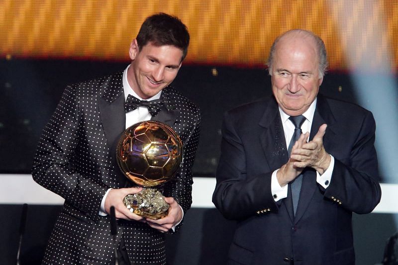 Lionel Messi (left) poses after winning the 2012 Ballon d&#039;Or