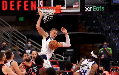 Kristaps Porzingis #6 dunks over Pascal Siakam #43.