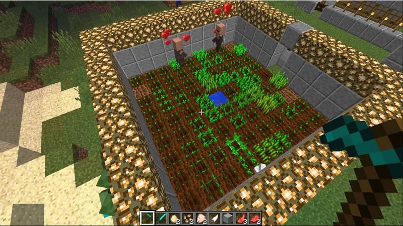 A player using two villagers to farm their crops (Image via YouTube)